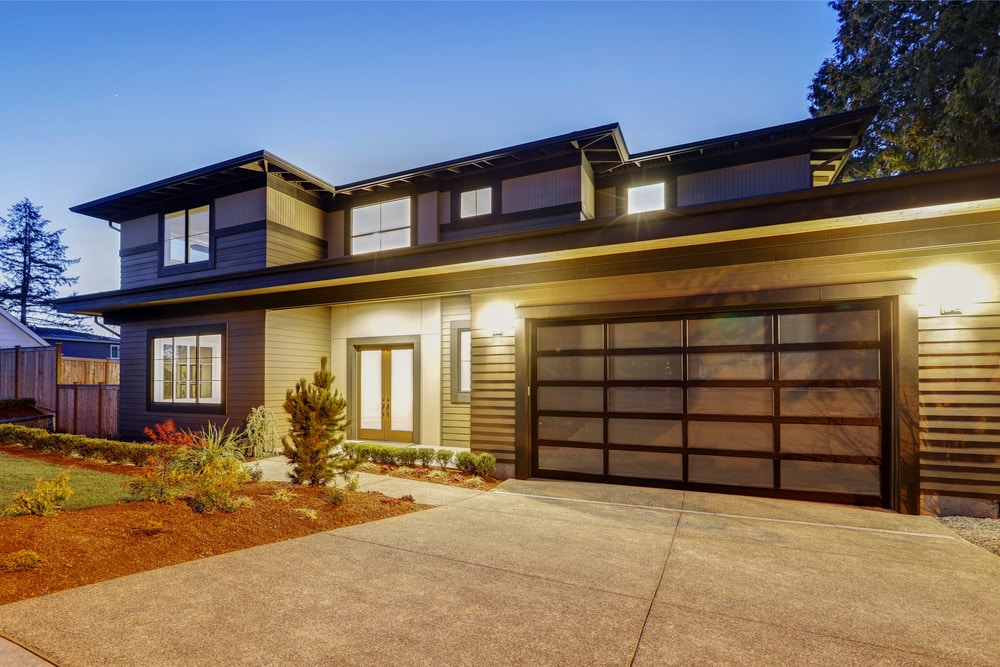 A home with a aluminum-frame garage door A home with a aluminum-frame garage door